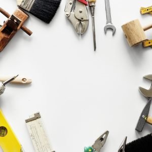 Flat lay of various technician tools isolated on white background